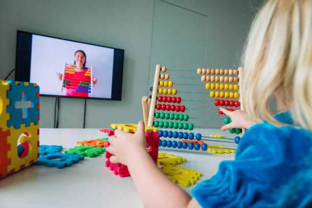 Young child enthusiastically engaging with an abacus, enjoying hands-on learning and developing essential mathematical skills through play