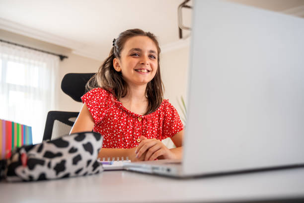 A child immersed in online English language learning activities, enhancing language skills and literacy with MasterMindz