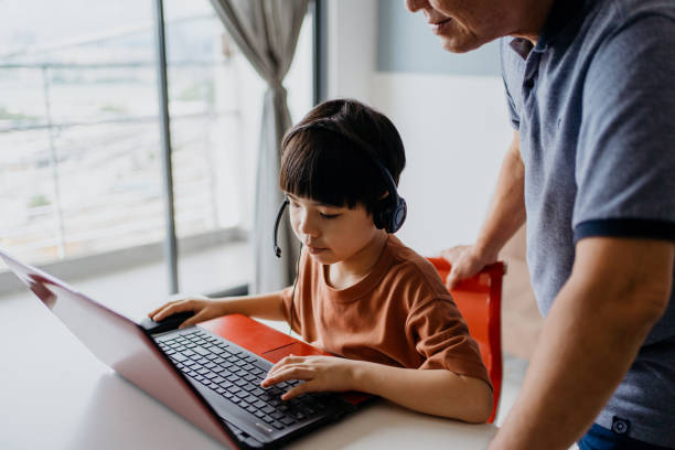 A child deeply engaged in online Mandarin learning, embracing cultural diversity and language acquisition with MasterMindz