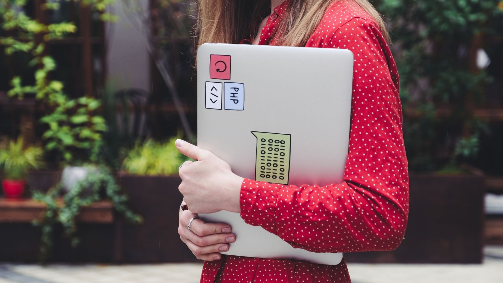 Young child learning coding for kids on a laptop using colourful block based programming