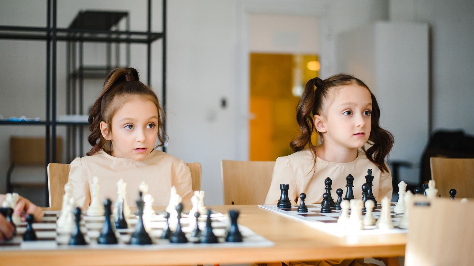 Child focused on a chess board during practice