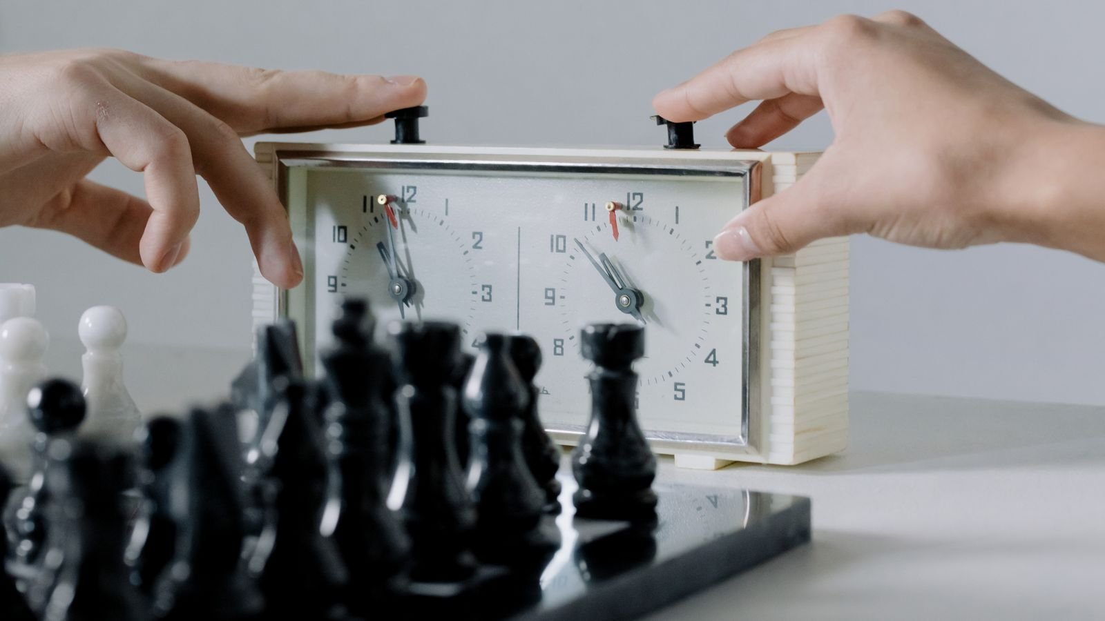Child playing a rated tournament game with a chess clock, illustrating how chess ratings work for kids