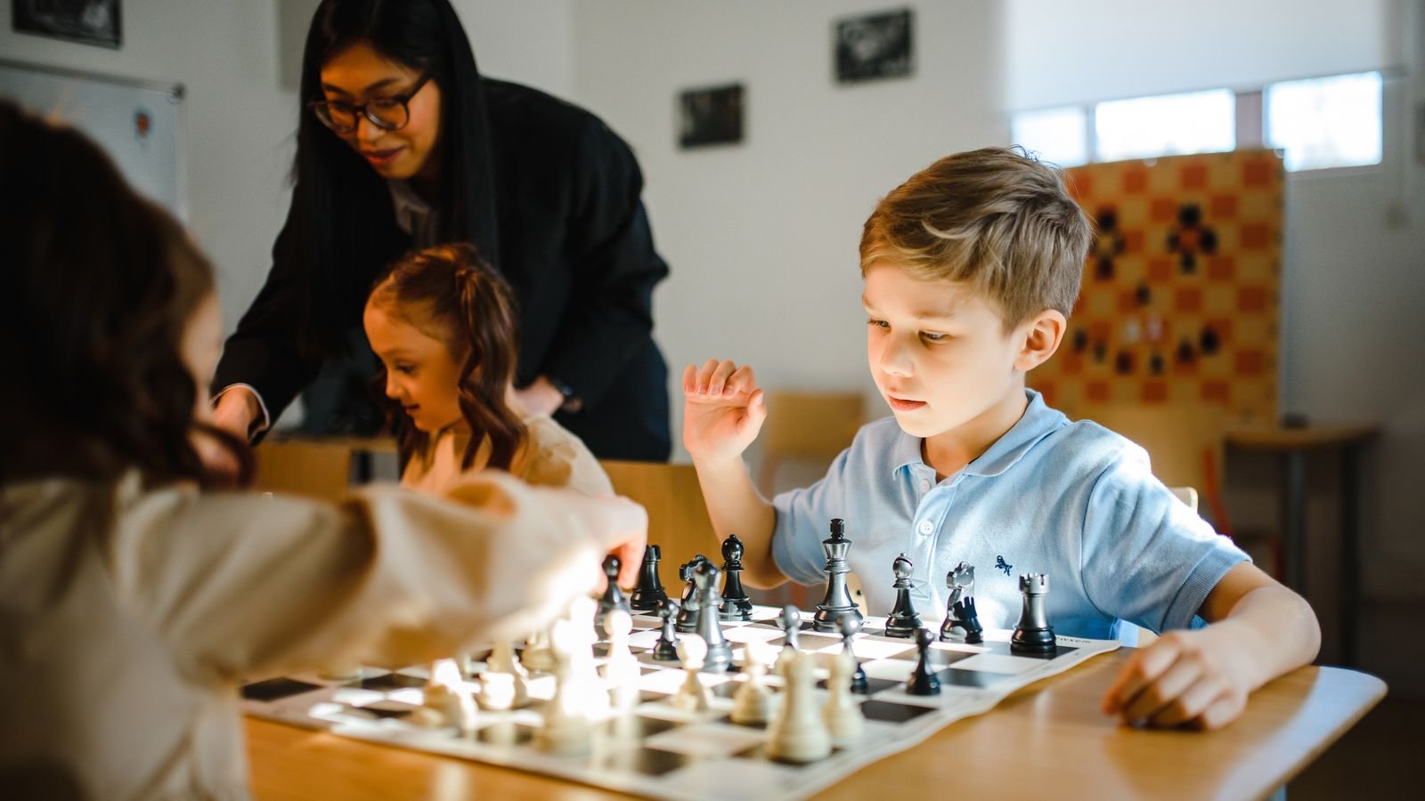 Young players concentrating at a junior chess tournament in Australia